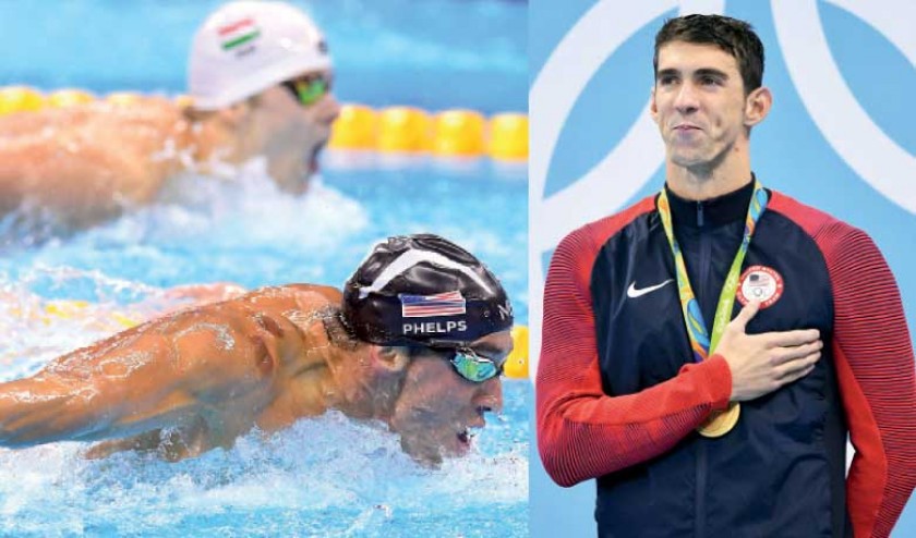El nadador norteamericano Michael Phelps se colgó ayer las medallas de oro en 200 mariposa y 4x200 metros libre.