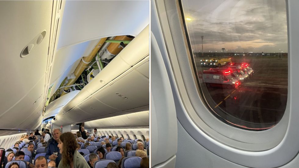 Una parte del avión se averió por las turbulencias; al lado, ambulancias a la espera del descenso de pasajeros.